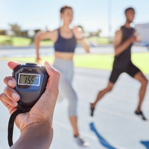 closeup-of-hand-timing-runners-on-a-race-track-bl-2023